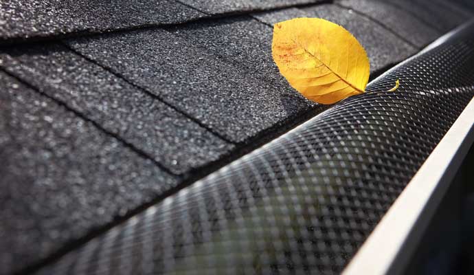 An installed gutter leaves guards made of a mesh material.