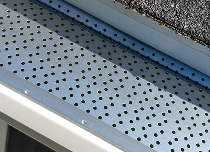 Perforated metal gutter guards