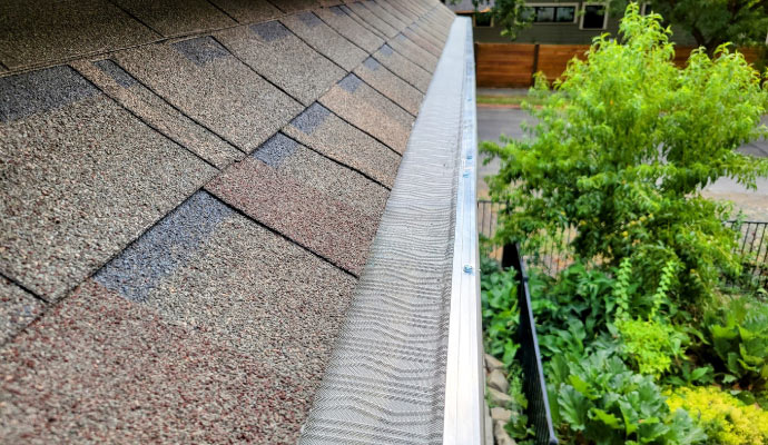 Technician installing gutter guards