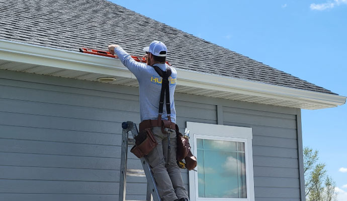 technician installing gutter