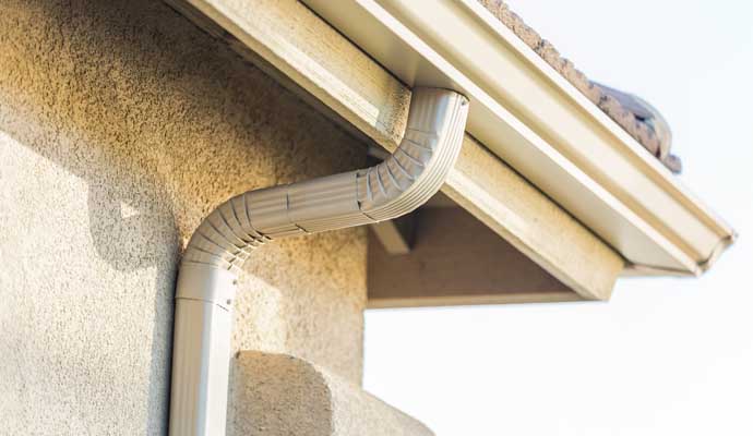 A downspout installed on the exterior of a building.