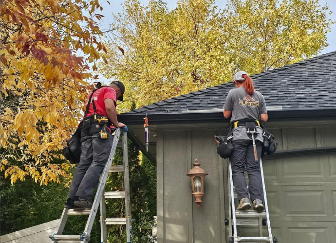 Team replacing gutter