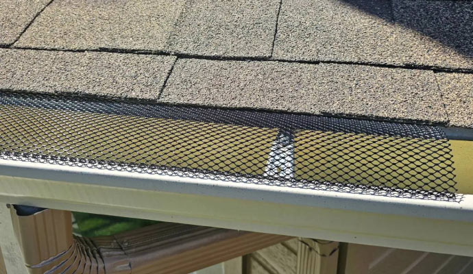 A gutter with a leaf guard installed.