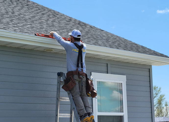 Professional installing gutter